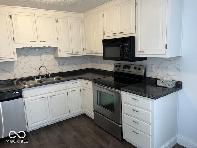 kitchen featuring dark hardwood / wood-style flooring, a textured ceiling, stainless steel appliances, sink, and white cabinets