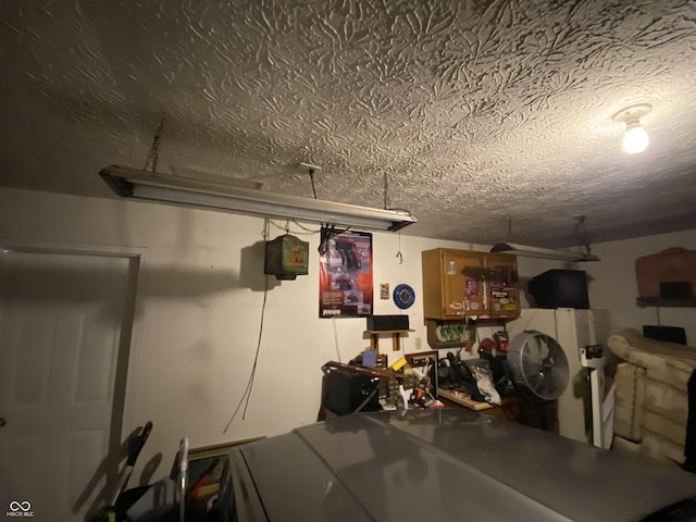 basement with a textured ceiling