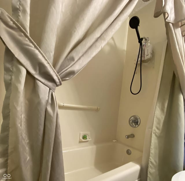 bathroom featuring shower / bath combination with curtain