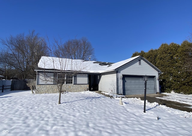 single story home featuring a garage