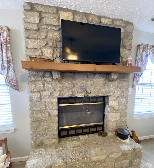 details with a stone fireplace