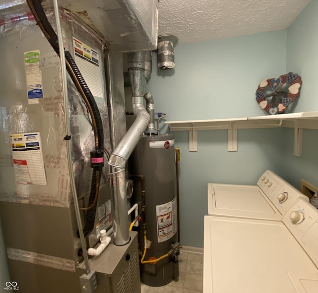 utilities with heating unit, water heater, and independent washer and dryer