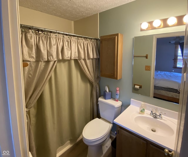 bathroom with vanity, a textured ceiling, toilet, and a shower with shower curtain