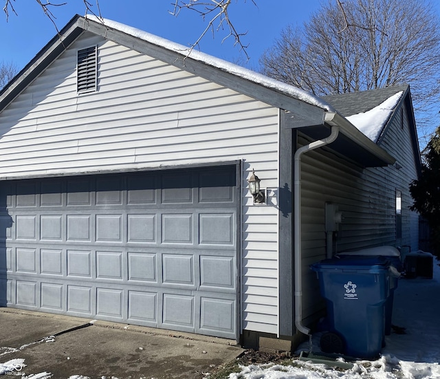 view of snow covered garage