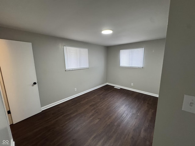 empty room featuring dark hardwood / wood-style floors