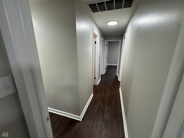 corridor featuring dark wood-type flooring