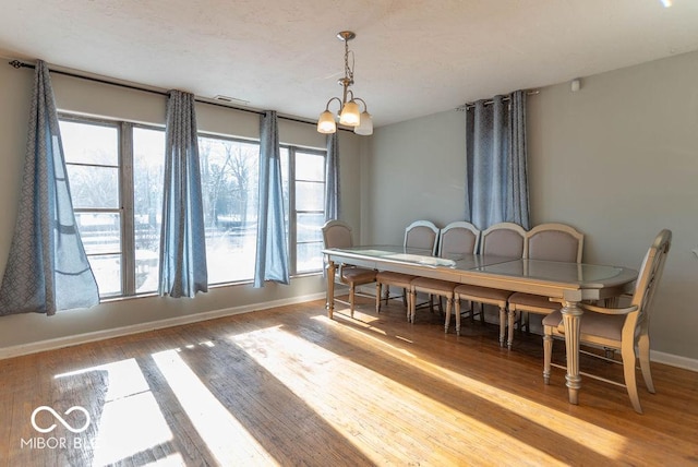 dining room featuring a chandelier and light hardwood / wood-style floors