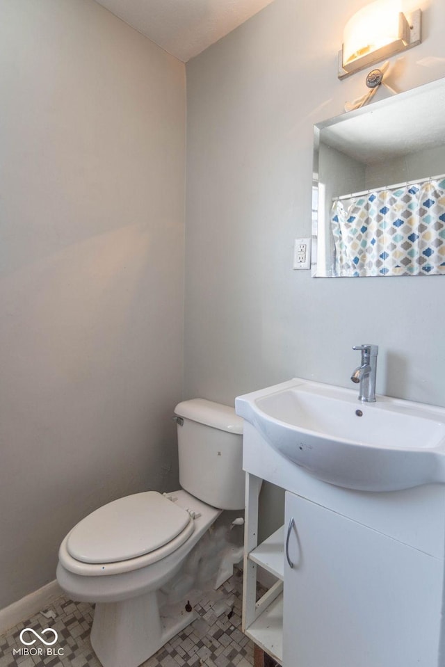 bathroom with tile patterned floors, toilet, and sink