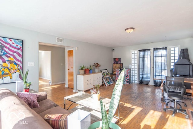 living room with french doors and hardwood / wood-style flooring