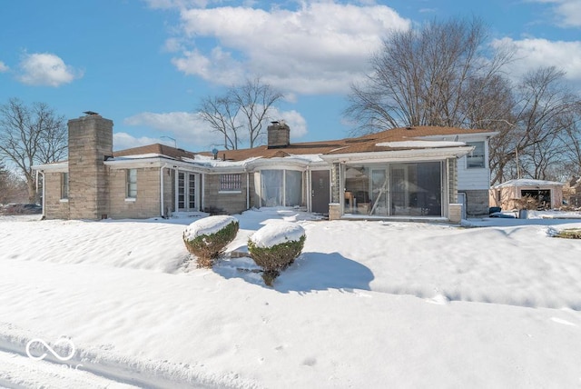 view of snow covered house