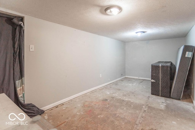 basement with a textured ceiling