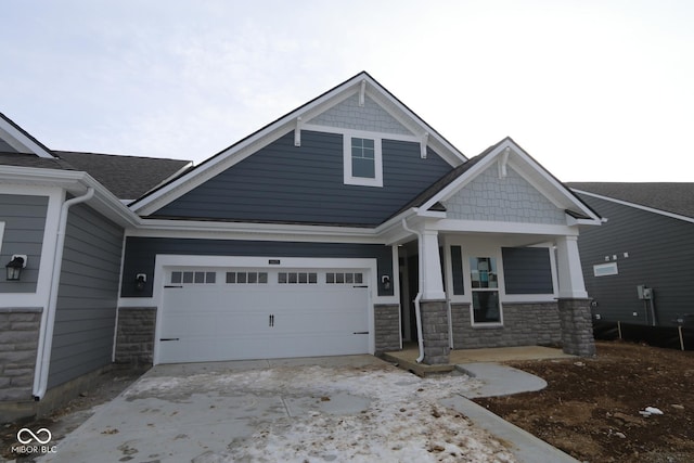 craftsman house with a porch and a garage