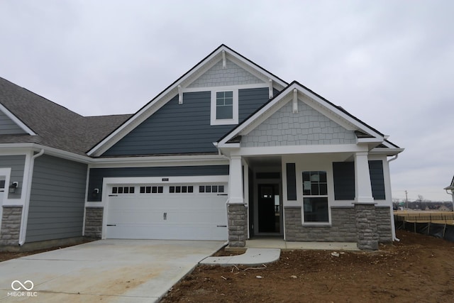 craftsman-style house featuring a garage and a porch