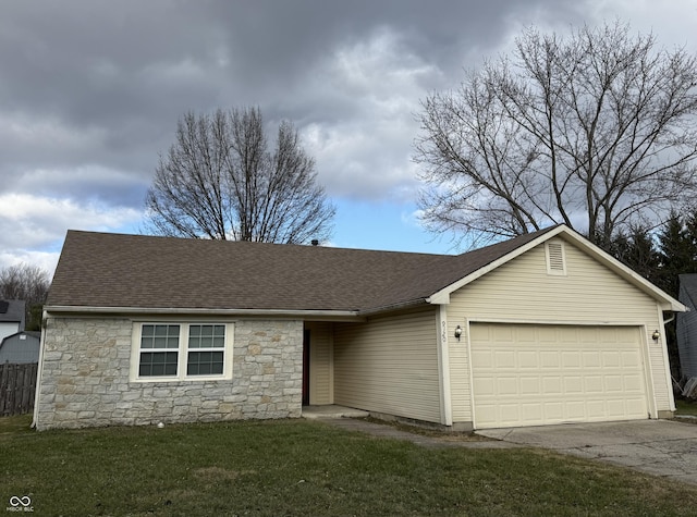 single story home with a garage and a front yard