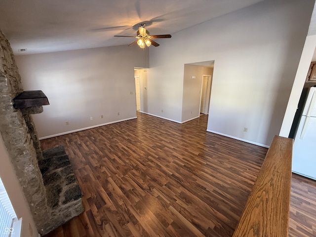 unfurnished living room with ceiling fan, dark hardwood / wood-style flooring, and lofted ceiling