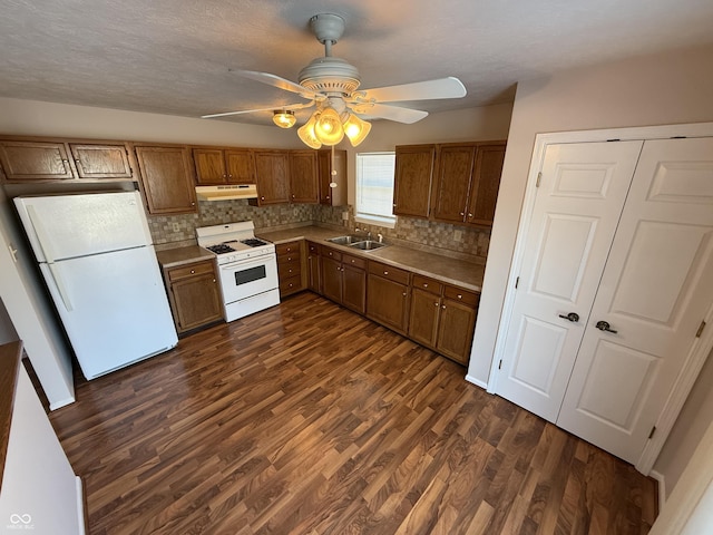 kitchen with tasteful backsplash, white appliances, ceiling fan, sink, and dark hardwood / wood-style floors