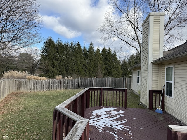 wooden terrace with a lawn