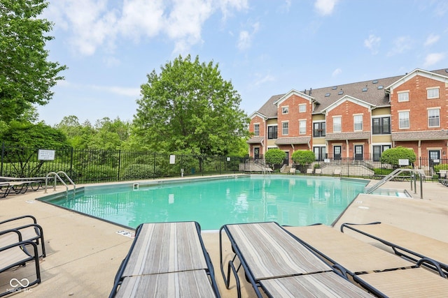 6595 Reserve Dr, Indianapolis, IN 46220 - community pool featuring fence, a patio, and a residential view