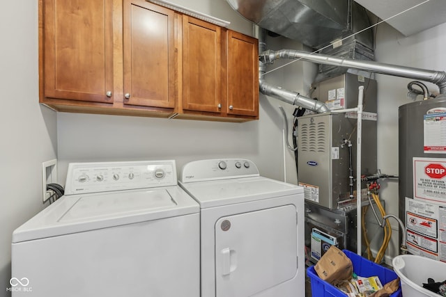 6595 Reserve Dr, Indianapolis, IN 46220 - laundry area with water heater, independent washer and dryer, and cabinet space