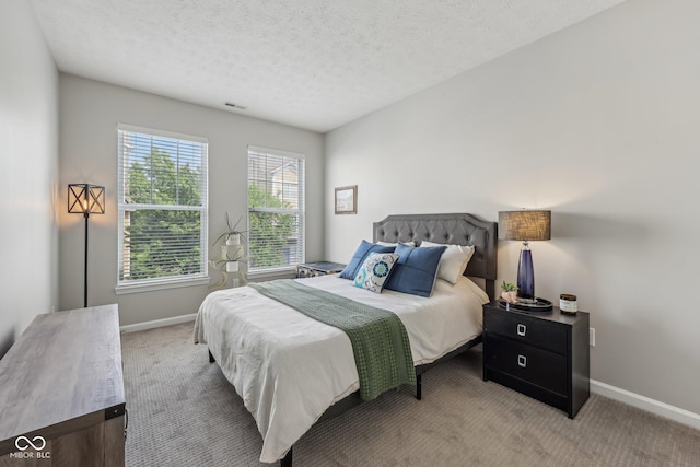 6595 Reserve Dr, Indianapolis, IN 46220 - carpeted bedroom with baseboards and a textured ceiling