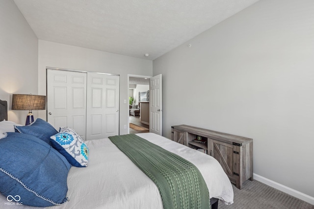 6595 Reserve Dr, Indianapolis, IN 46220 - bedroom with carpet, a closet, and baseboards