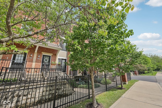 6595 Reserve Dr, Indianapolis, IN 46220 - view of front facade featuring brick siding and a fenced front yard