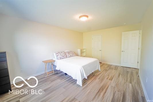 bedroom with light hardwood / wood-style flooring