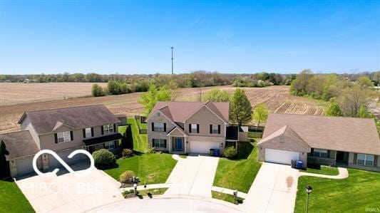 birds eye view of property with a rural view