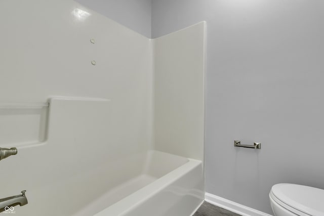 4652 Kimmeridge Ln, Indianapolis, IN 46254 - bathroom featuring toilet and shower / washtub combination