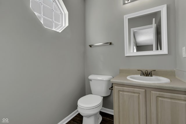 4652 Kimmeridge Ln, Indianapolis, IN 46254 - half bathroom featuring vanity and wood finished floors