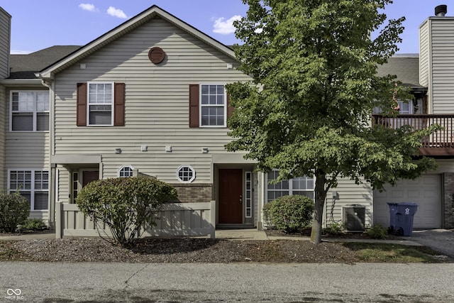 multi unit property with cooling unit and a garage