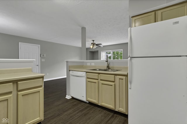 kitchen featuring cream cabinetry, white appliances, ceiling fan, and sink