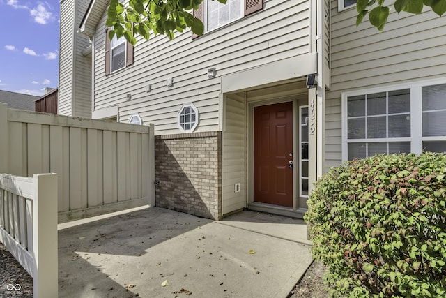 4652 Kimmeridge Ln, Indianapolis, IN 46254 - view of exterior entry featuring brick siding and a patio area