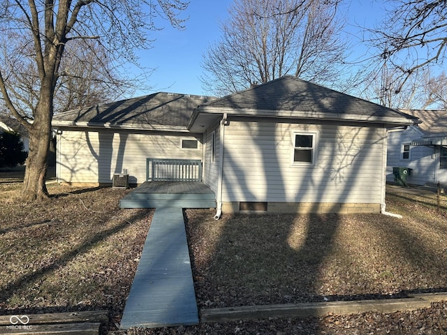 view of side of property with a wooden deck and central air condition unit