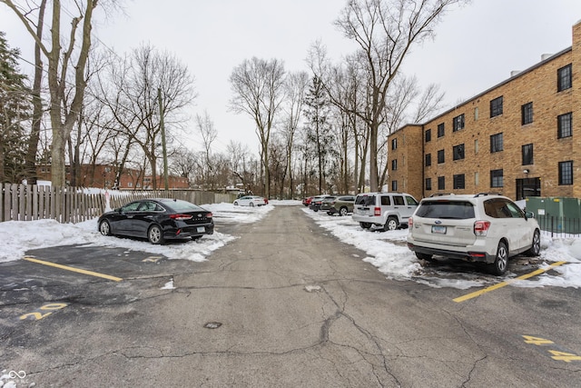 view of snow covered parking