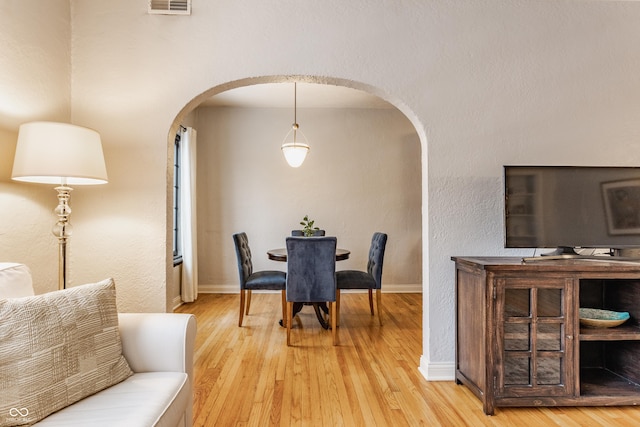 dining room featuring wood-type flooring