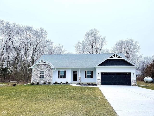 view of front facade with a garage and a front lawn