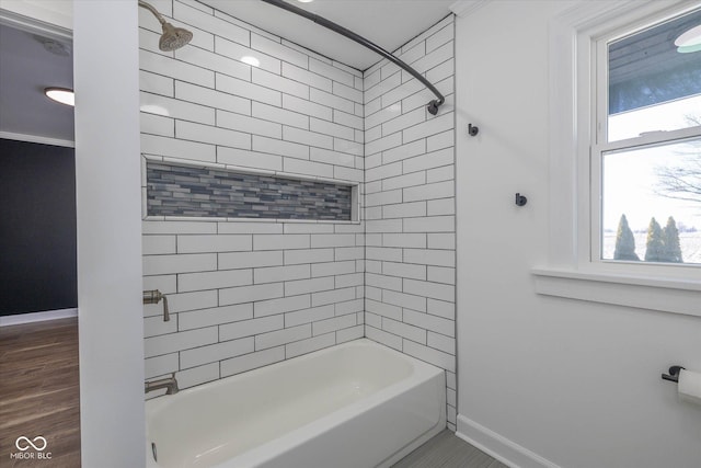 bathroom with tile patterned flooring and tiled shower / bath combo