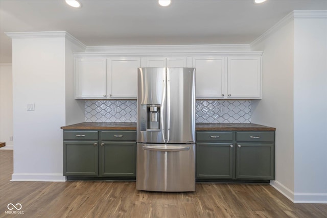 kitchen featuring white cabinetry, decorative backsplash, stainless steel fridge with ice dispenser, and dark hardwood / wood-style floors