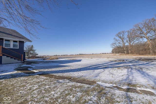 view of yard layered in snow