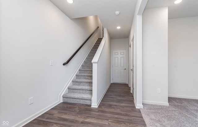 staircase featuring hardwood / wood-style flooring