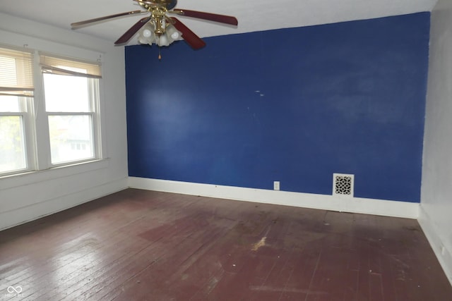 spare room with hardwood / wood-style flooring, plenty of natural light, and ceiling fan