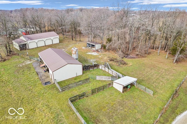 birds eye view of property with a rural view