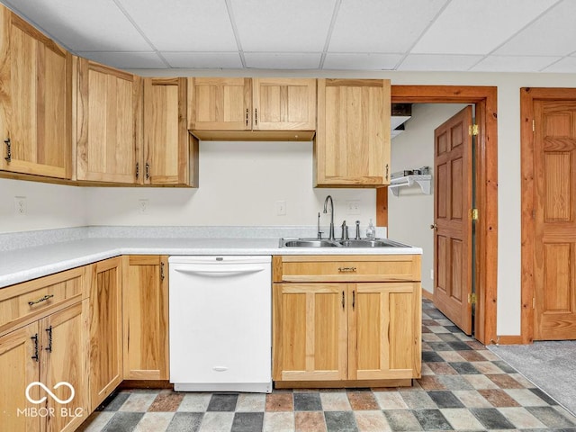 kitchen with white dishwasher, a drop ceiling, light brown cabinets, and sink