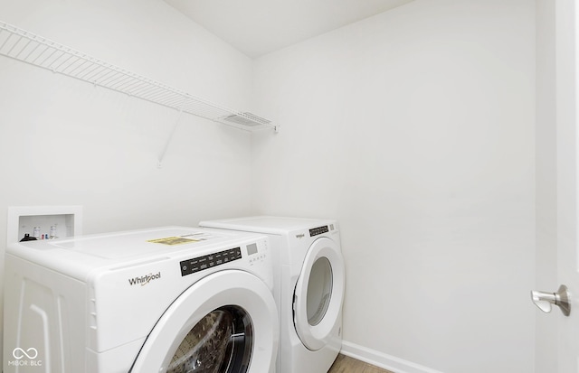 laundry room featuring washing machine and clothes dryer