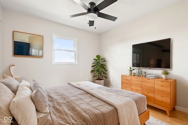 bedroom with hardwood / wood-style flooring and ceiling fan