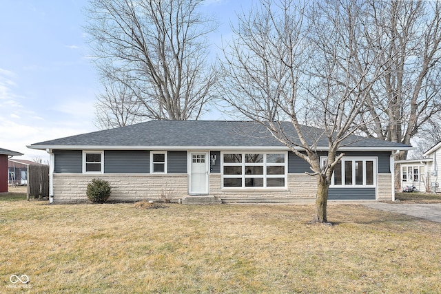 ranch-style home featuring a front yard