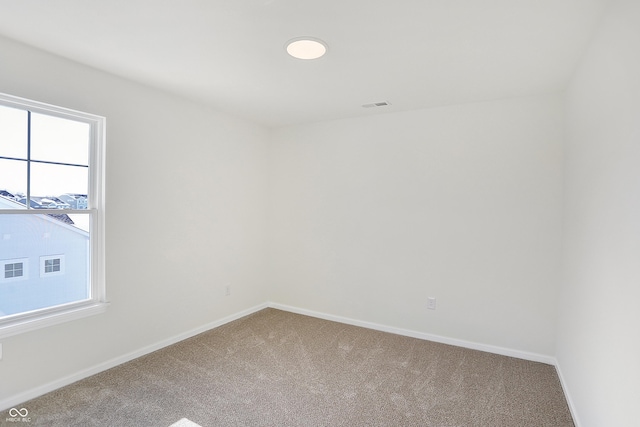 empty room with carpet flooring