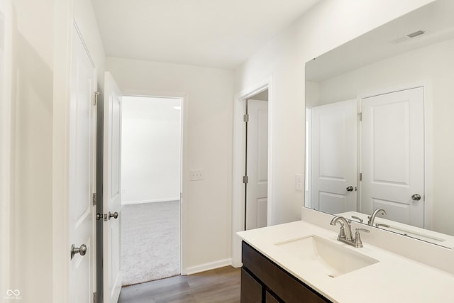 bathroom featuring vanity and wood-type flooring