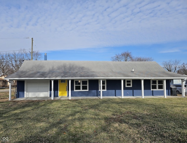 ranch-style home with a front lawn and a garage